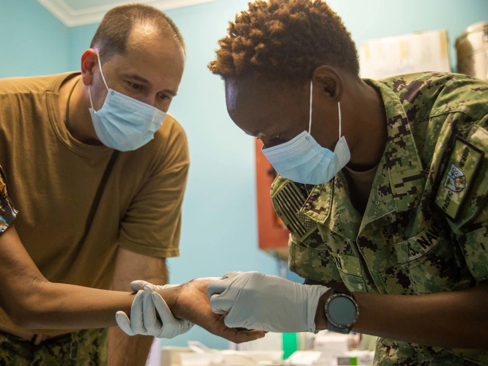 Caring for a local patient at National Referral Hospital during Pacific Partnership 2022 — Honiara, Solomon Islands.